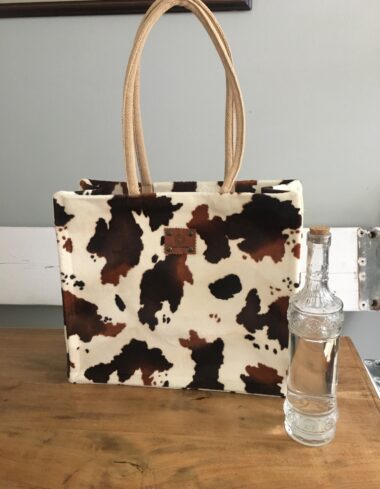 Duurzame jute shopper bekleed met bontachtige bruinbonte koeienprint